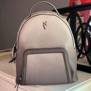 An airbrushed dark to light purple bag